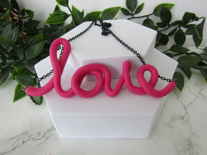 Induere | Handmade LOVE Necklace | Cursive Polymer Clay Word Pendant |   Raspberry Pink
