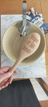 Wooden spoon engraved with 'weapon of Ma's destruction'