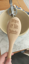 Wooden spoon engraved with 'weapon of Ma's destruction'