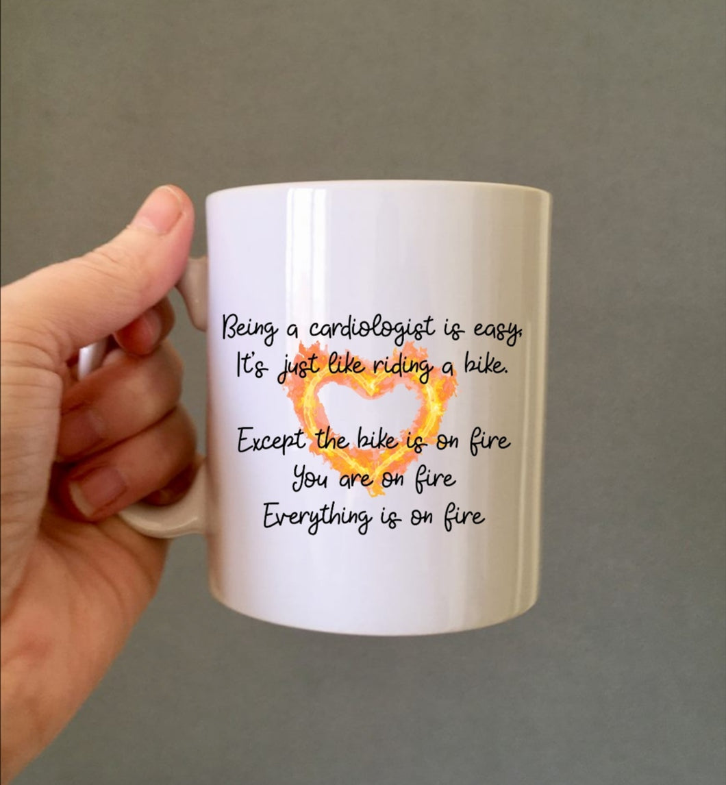 Cardiologist heart flame bike quote ceramic mug